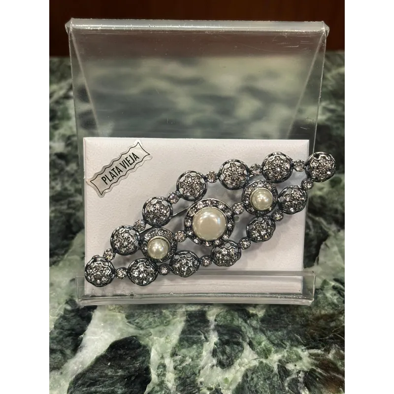 Broche Vega